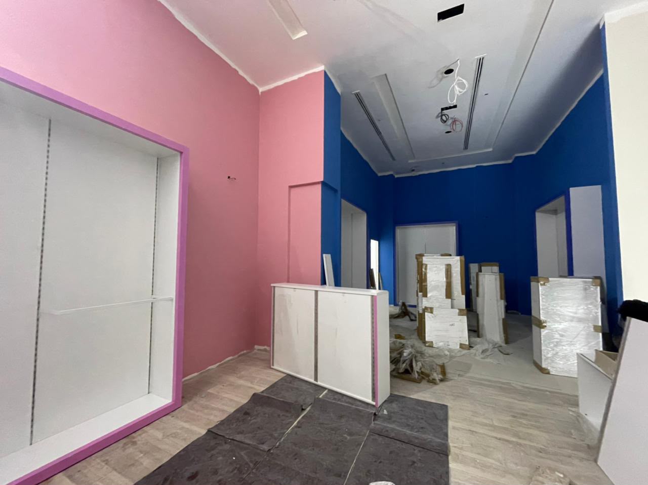 Retail unit interior fit-out with painted feature walls in progress
