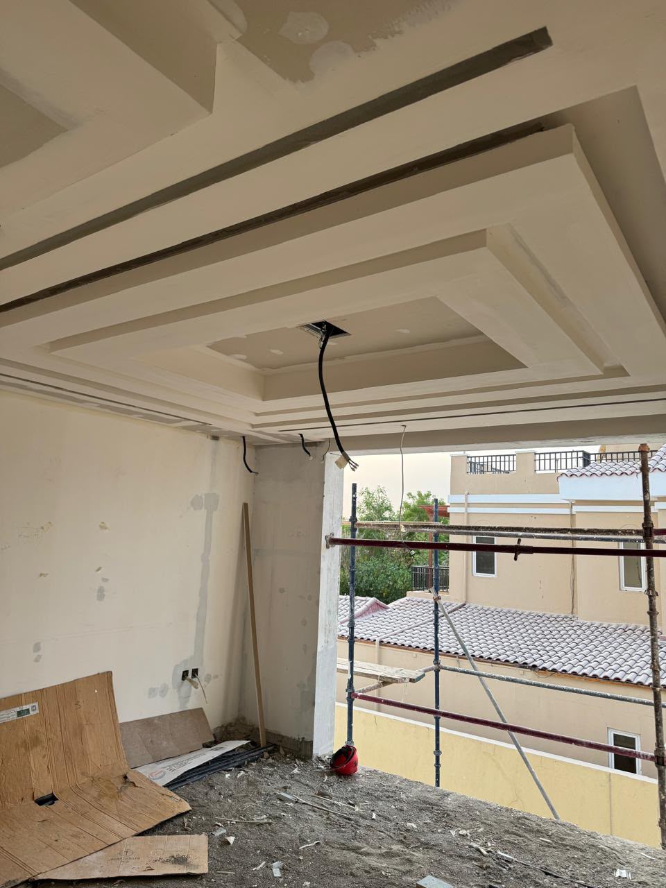 Residential ceiling framing and scaffolding on an exterior balcony