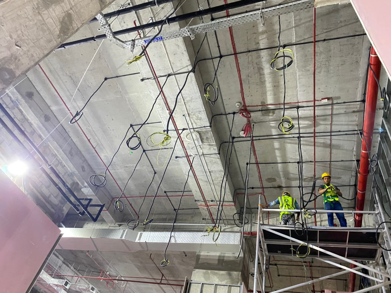 MEP electrical and cabling installation above a commercial ceiling